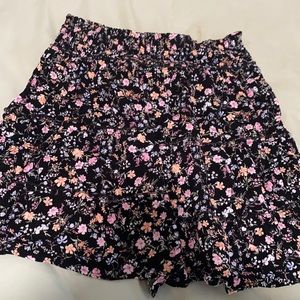 Black floral print mini skirt